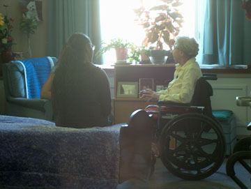 Intergenerational program volunteers visit with each other
