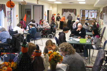 Intergenerational volunteers at a Halloween event