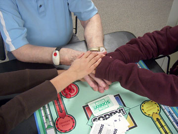 Intergenerational volunteers joining hands